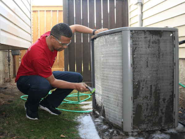Arpi's Calgary cleaning an air conditioner