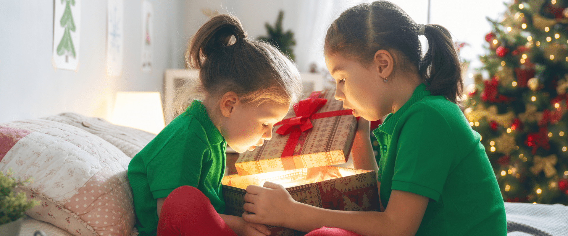 girls opening presents on Christmas